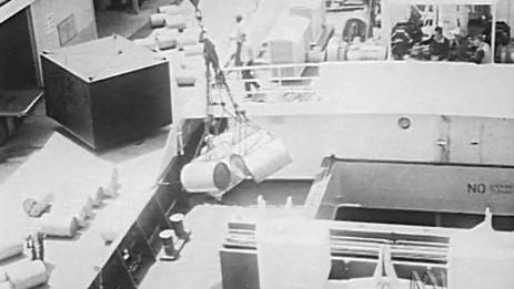 Cargo is lowered onto a expedition vessel