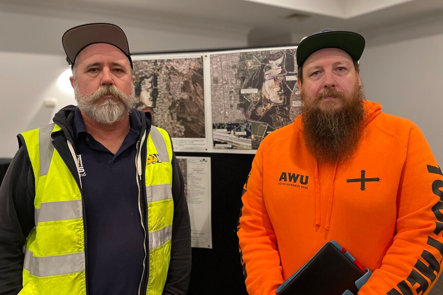 Two men wearing hats, beards and AWU clothing. 