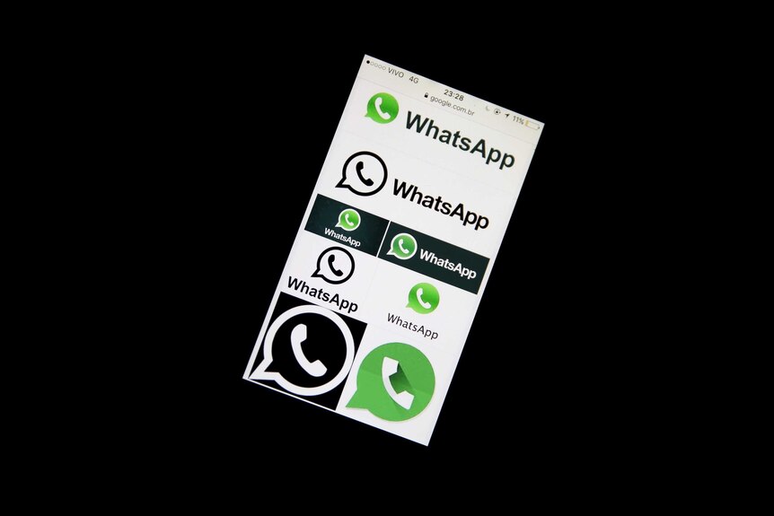 An image of a phone with the Whatsapp messaging service on the screen.