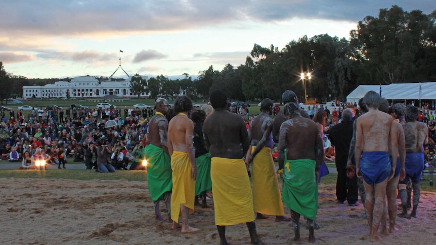 Crowd watches Lorrkkon Indigenous ceremony.