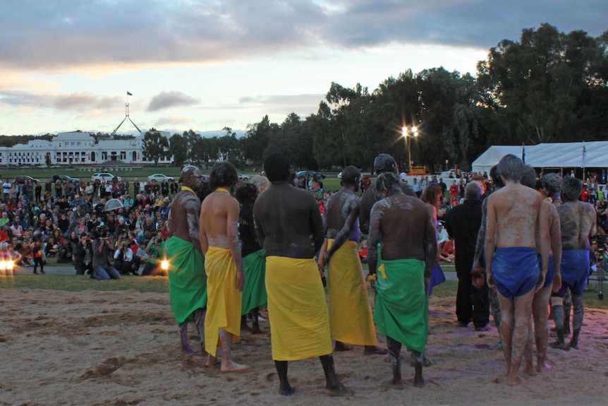 A large crowd watched the enthralling performance at dusk.