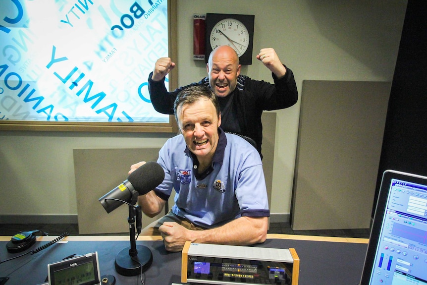 ABC Local Radio Queensland presenters Rob Mailer and Tim Cox clown around in one of ABC's Brisbane studios.