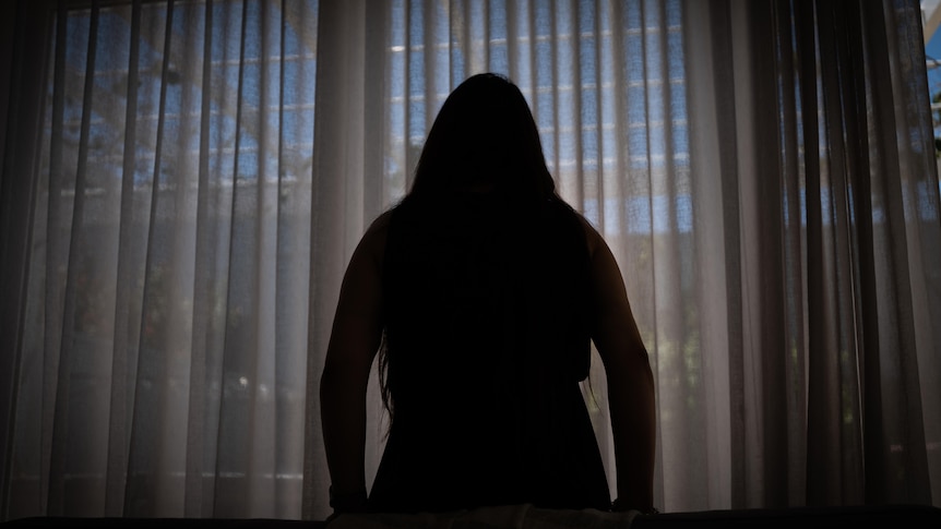 A silhouette of domestic violence victim Jane