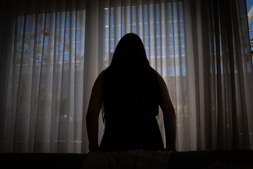 A silhouette of domestic violence victim Jane