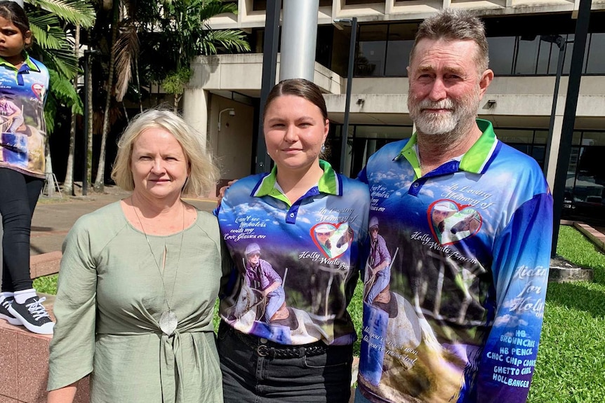 Elle Brown, Jessica Eagle-Rowe and Warren Brown, stand outside court in Cairns in Qld.