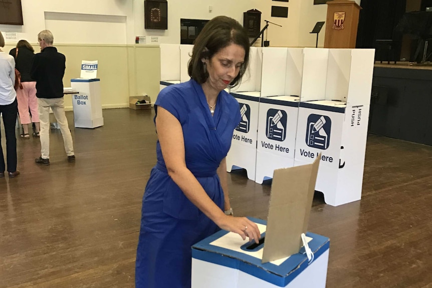 Carolyn Corrigan voting.