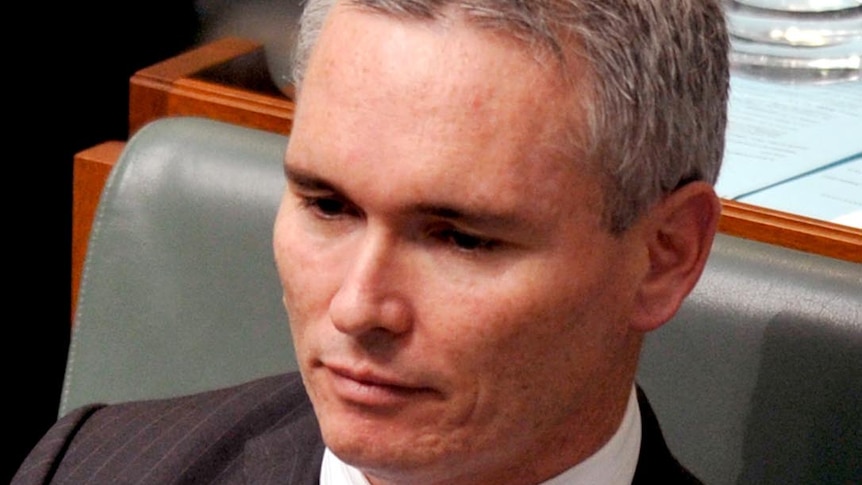 Craig Thomson listens during question time at Parliament House, Canberra