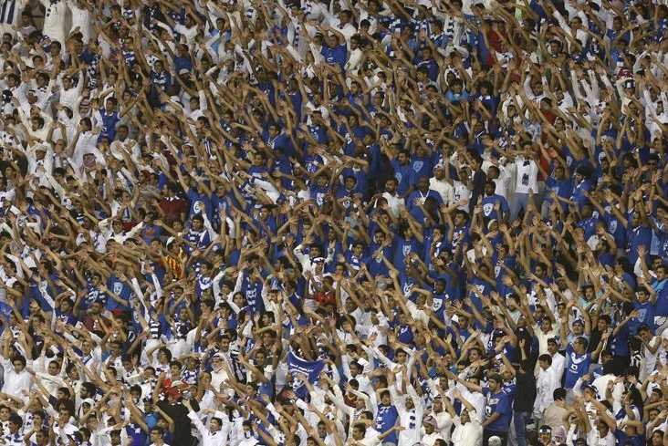 Fans of Saudi Arabia's Al Hilal chant and cheer.