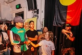 11-year-old rapper Inkabee grins up at superstar Chance The Rapper at The Lord Gladstone pub in Sydney.