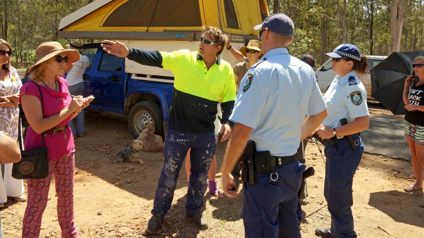 Residents and police at a blockade of a coal seam gas well near Glenugie.