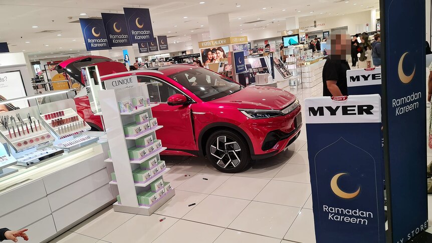Red car accelerates at Westfield Liverpool Myer into the beauty counters