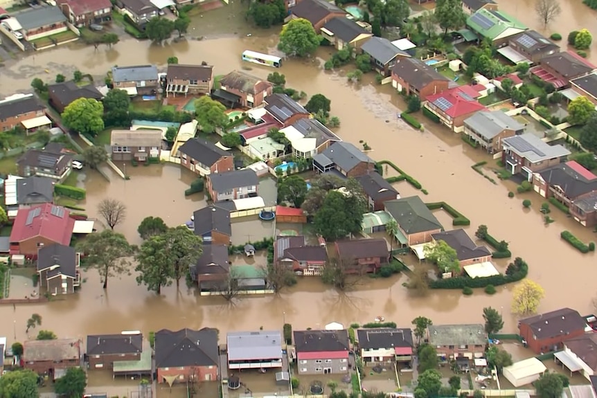 Flood waters surrounding houses