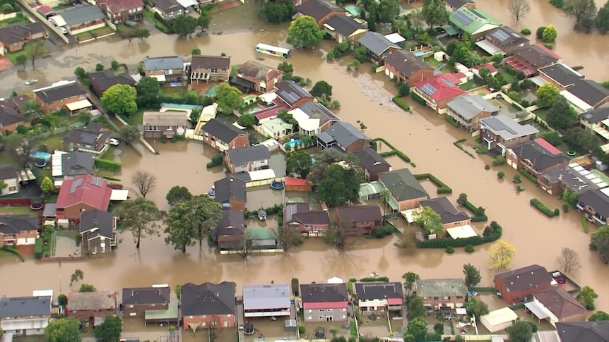 Flood waters surrounding houses