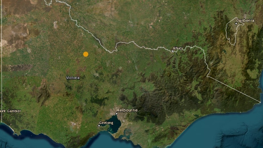 A map of the state of Victoria with a yellow dot marking where an earthquake was recorded.
