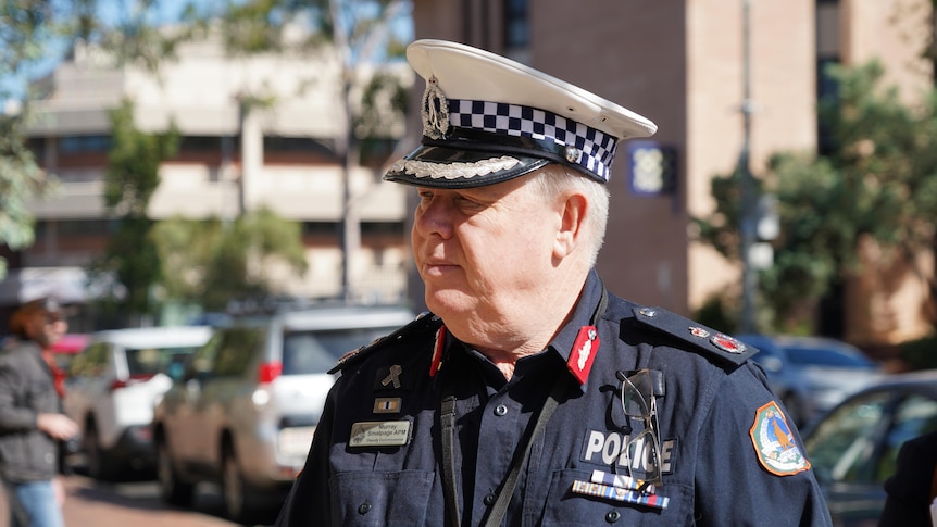 A close-up shot of a man in a police uniform