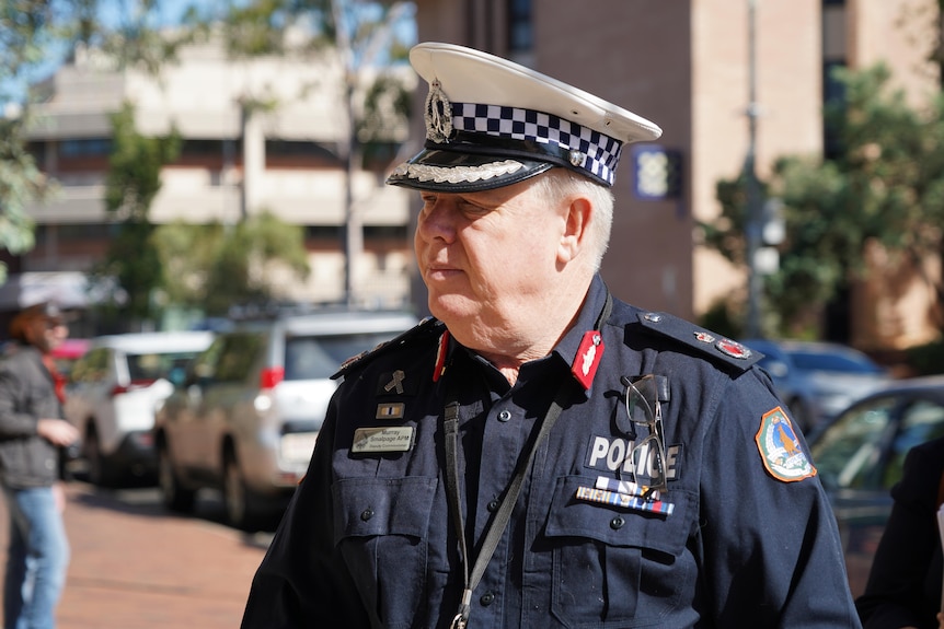 A close-up shot of a man in a police uniform