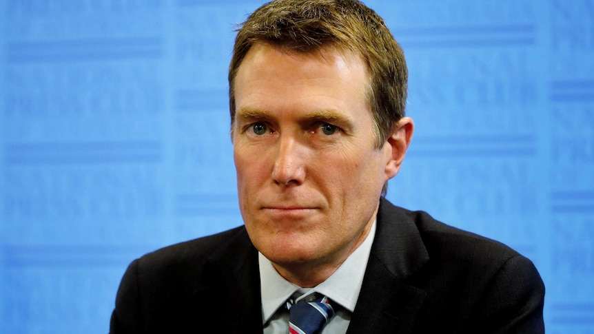 Social Services Minister Christian Porter speaking to media after making a welfare announcement.