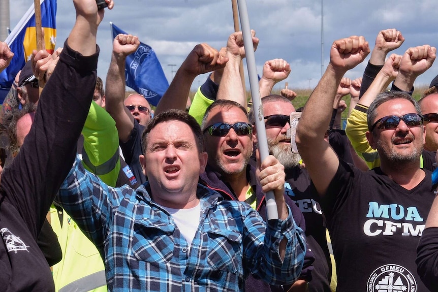 Union members march to Webb Dock during an industrial action dispute.