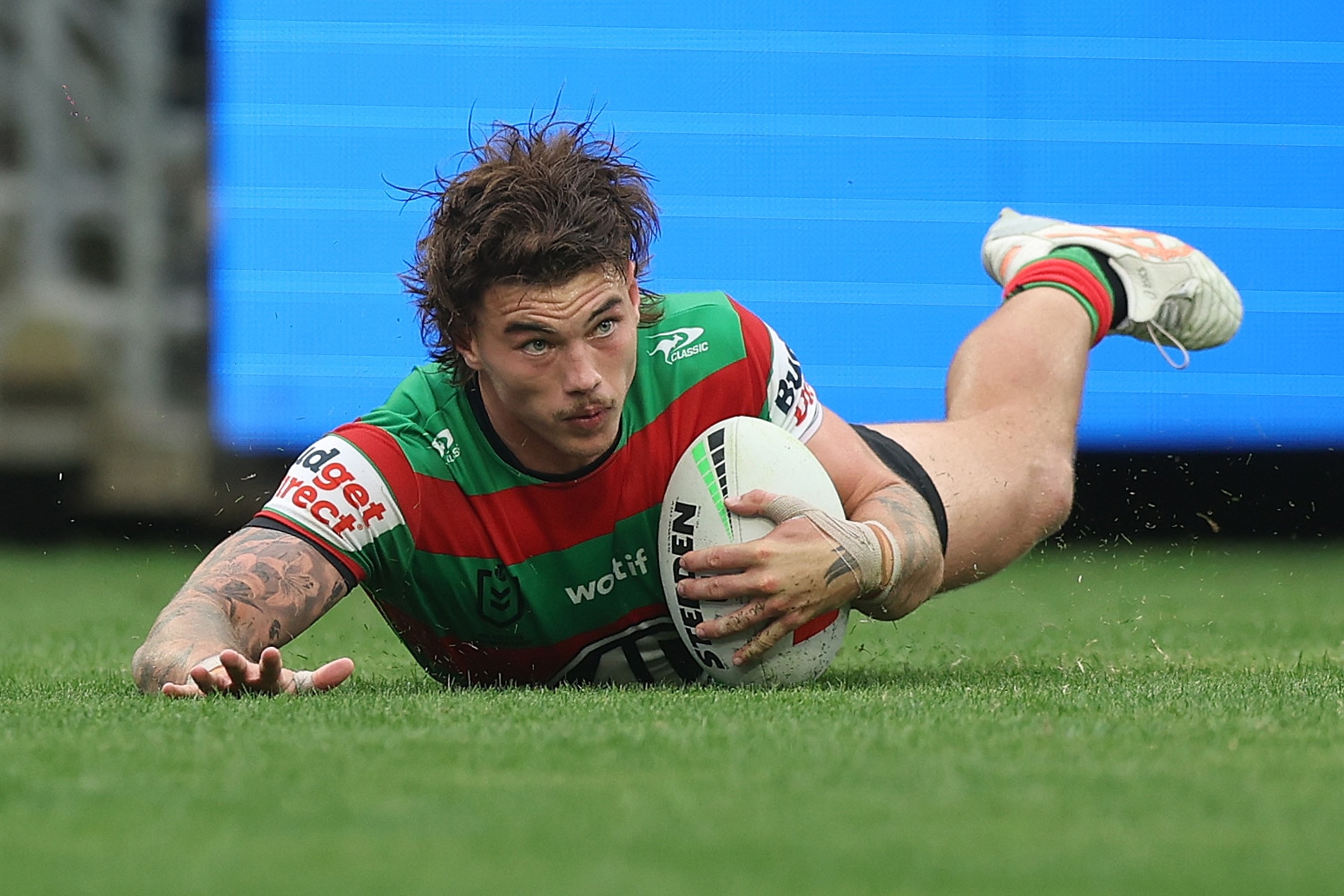 A man scores a try in a rugby league match 