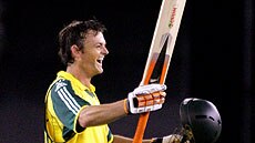 An ecstatic Adam Gilchrist celebrates his ton against the World XI