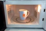 Cup and teabag in the microwave