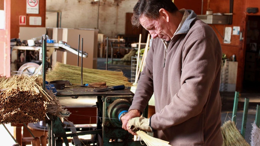 Broom maker making brooms in the Tumut factory.