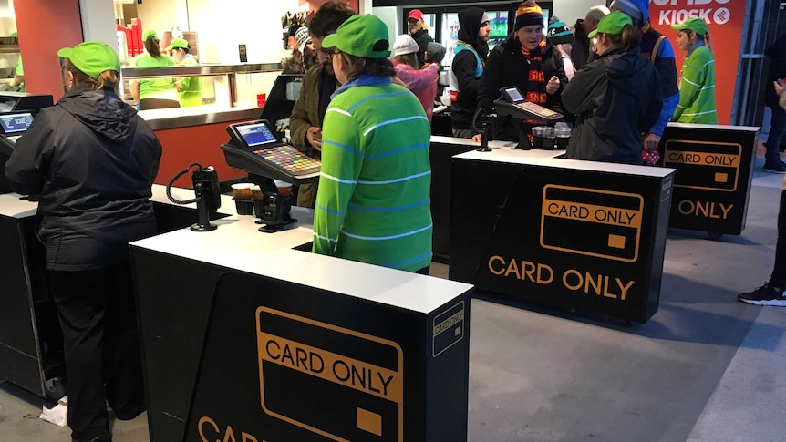 Series of tills with card only signs.