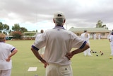 A Mundoora bowls player looks out onto the green.