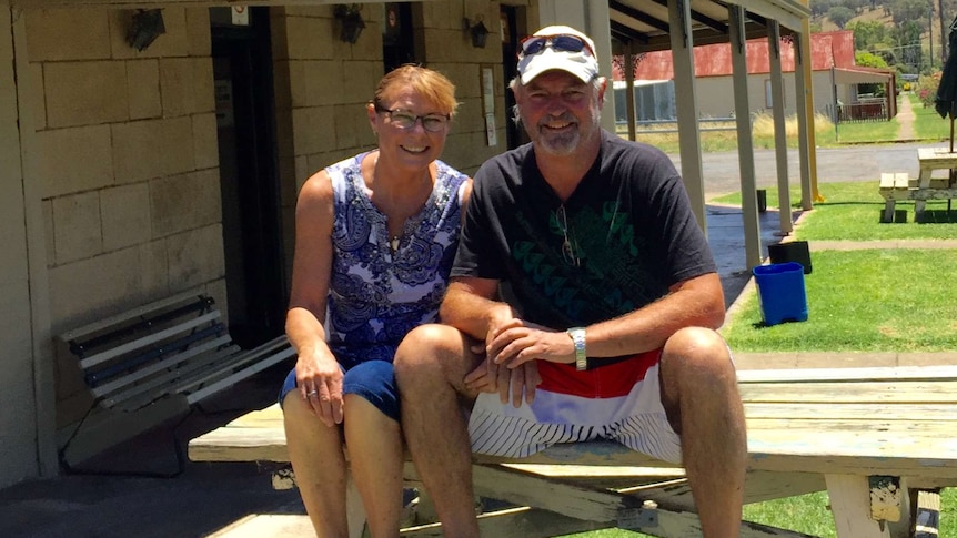 Lisa and Glenn Pratt sit at a table at the front of the Marshall MacMahon Hotel at Wallabadah