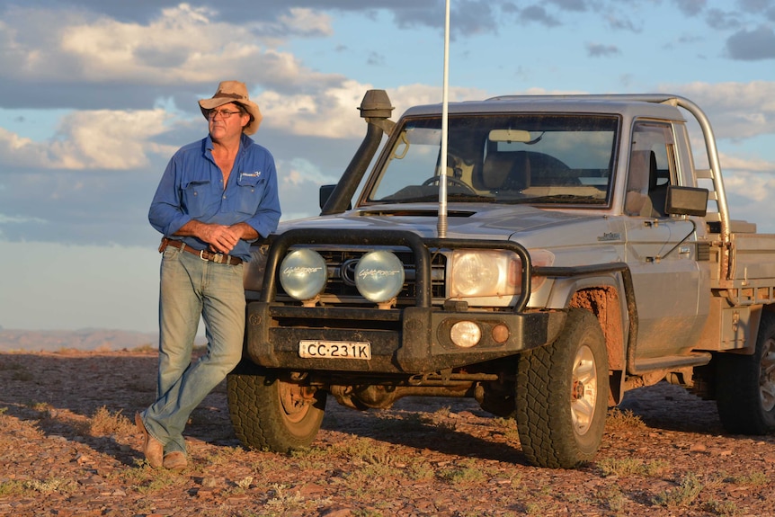 Ross Fargher leans on his vehicle.