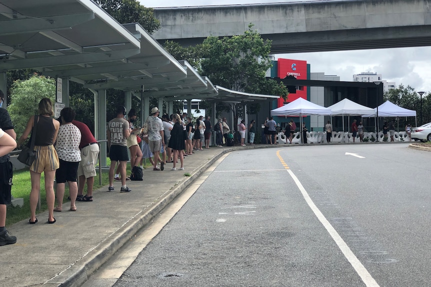 A line of people wrapped around a corner.