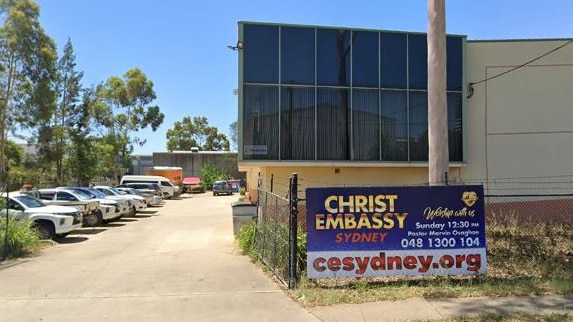 The exterior of a building with a sign that says Christ Embassy Sydney.