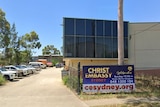 The exterior of a building with a sign that says Christ Embassy Sydney.