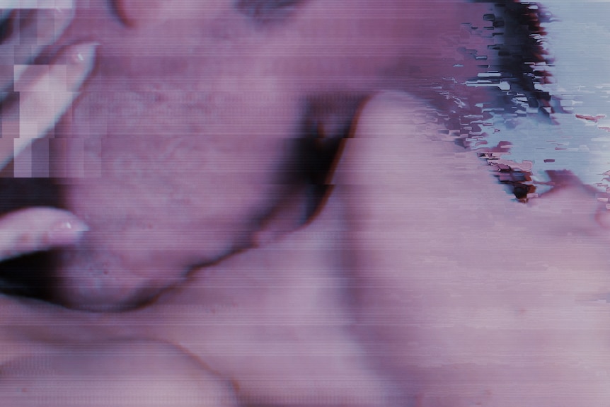 A blurred close up of a man kidding a woman's neck