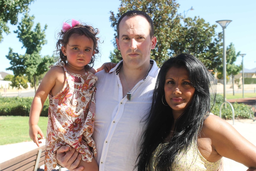 Sudha with her partner Lionel who is holding their young daughter Lila