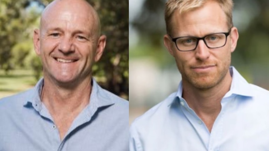 Two men in blue shirts 