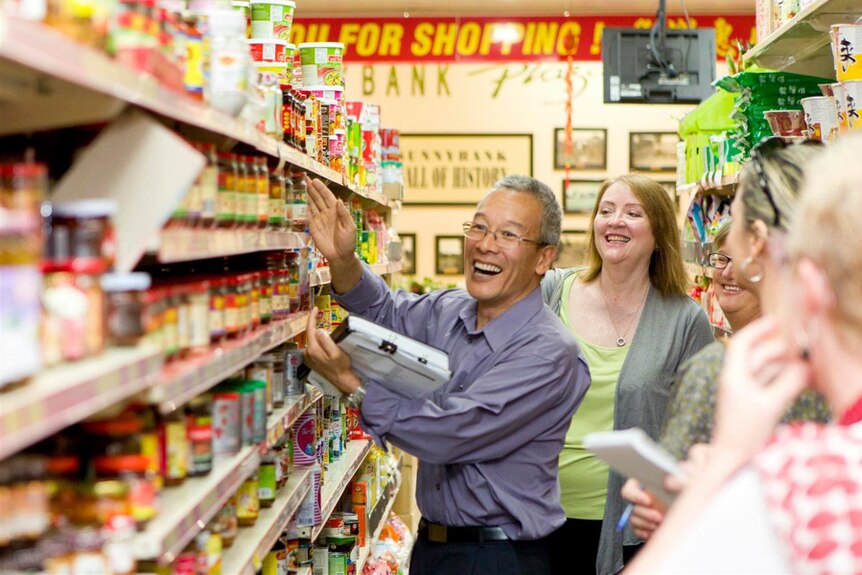 People standing in Asian grocers in Sunnybank.