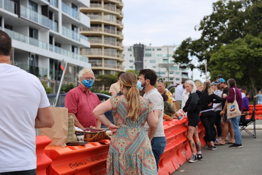 Families reunited at the border barriers between Queensland and NSW on Father's Day to share picnics with loved ones.