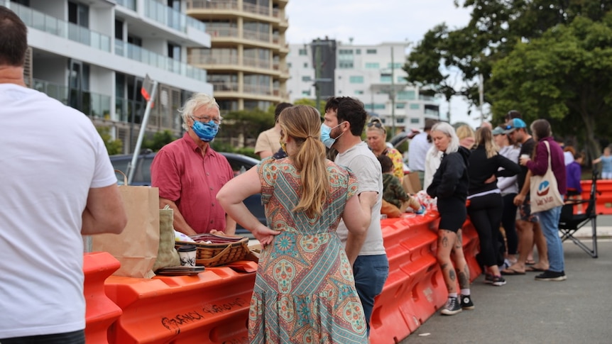 Families reunited at the border barriers between Queensland and NSW on Father's Day to share picnics with loved ones