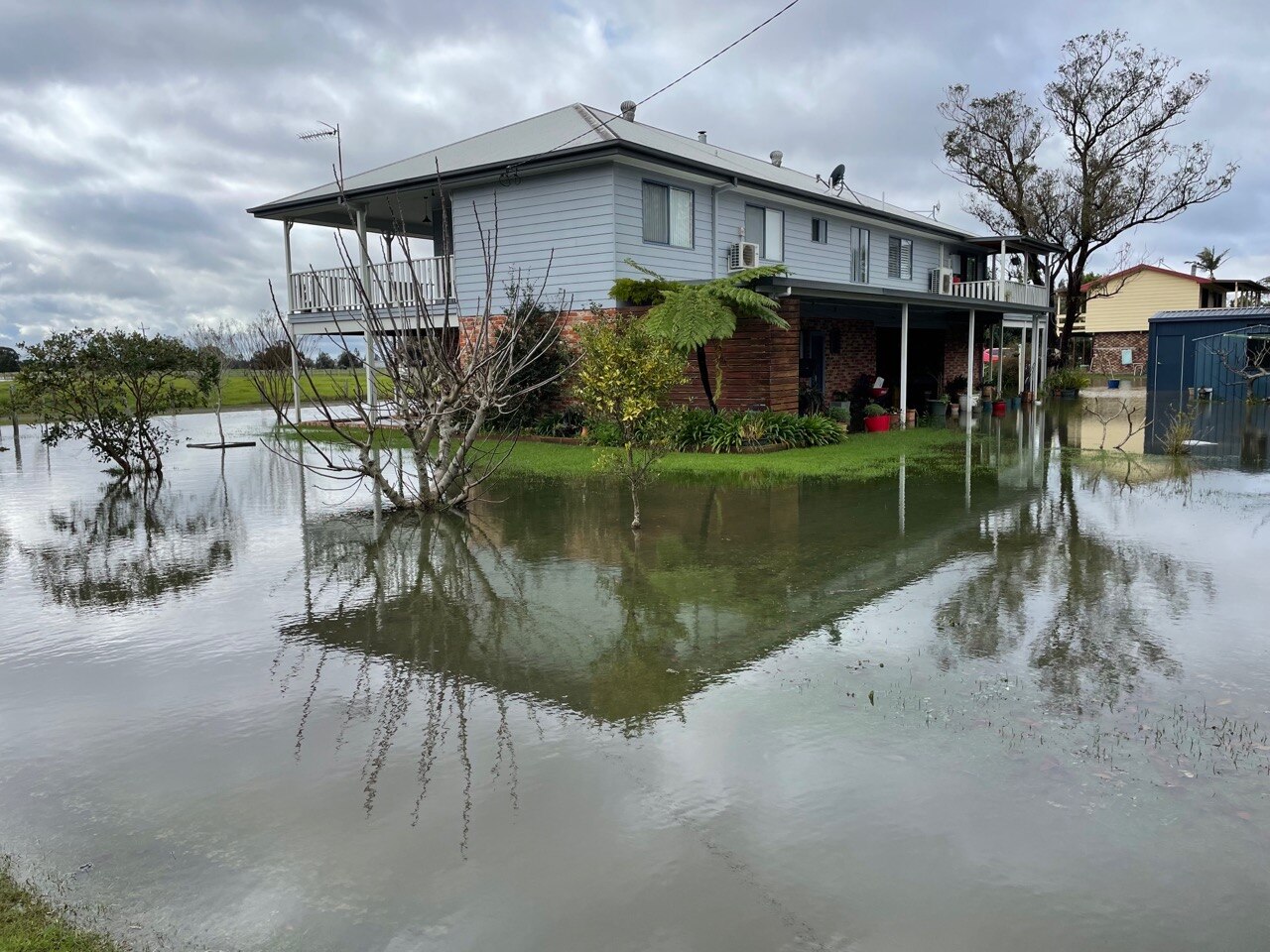 house with water surrounding it 