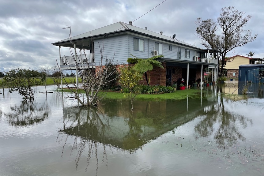 house with water surrounding it 