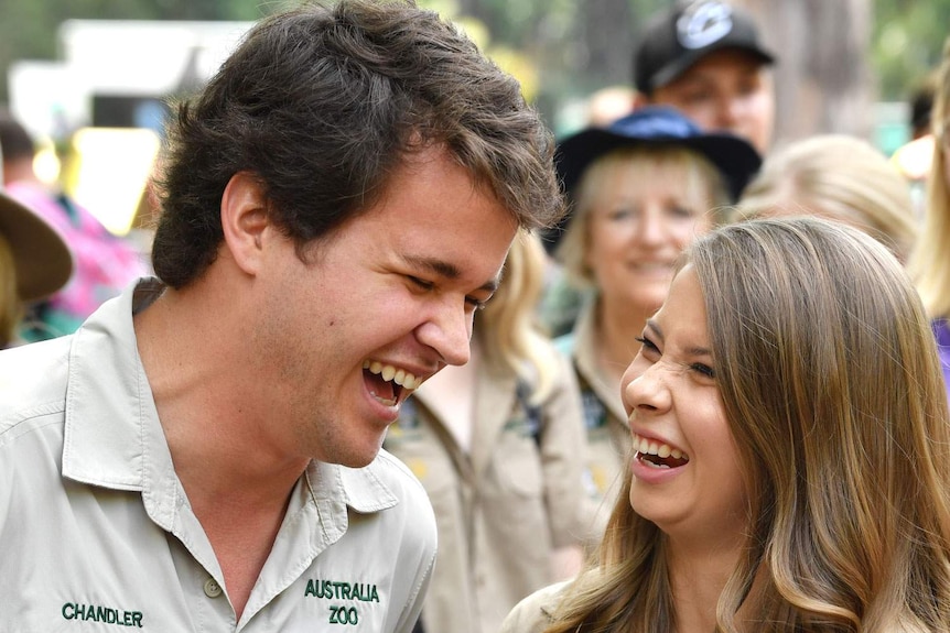 Chandler Powell (left) and Bindi Irwin (right) laugh together.