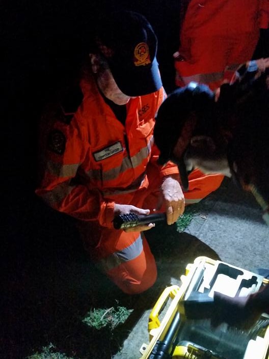 Yeppoon SES volunteers prepare for night training by torchlight.
