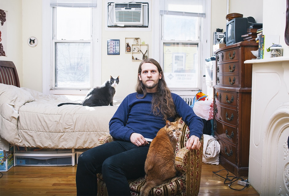 A portrait of man with his cat shot by Brooklyn-based photographer David Williams.