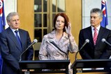 Simon Crean (left), Stephen Smith (right) with Julia Gillard (centre).