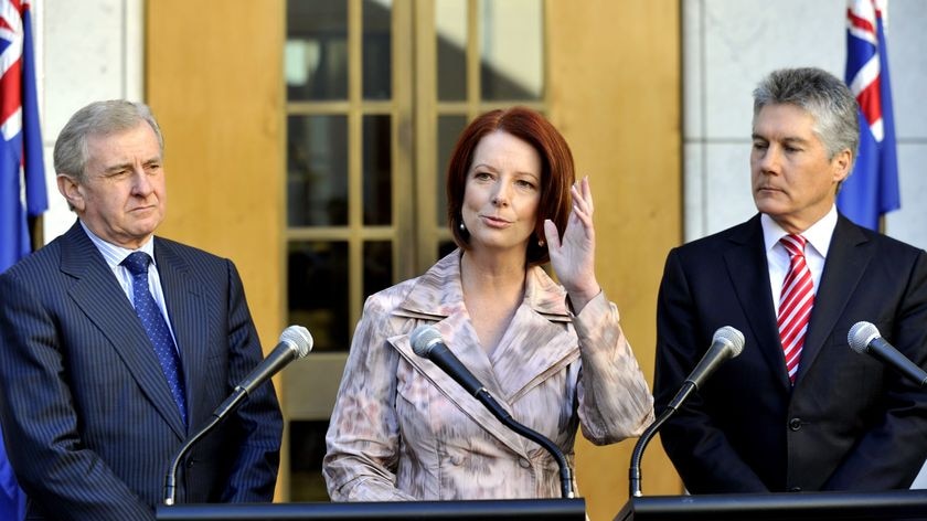 Simon Crean (left), Stephen Smith (right) with Julia Gillard (centre).