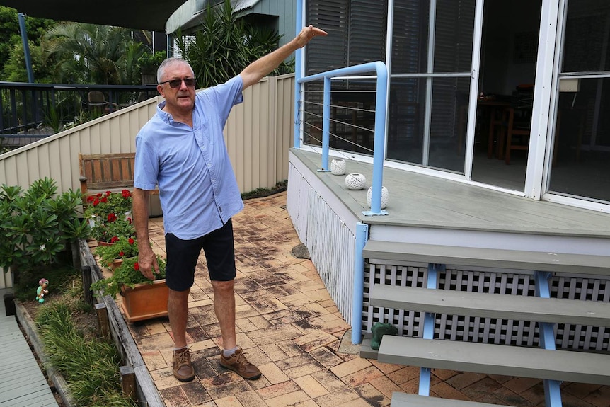 Barry Sommerlad, on January 11, 2021, shows how high the floodwaters came up to his home at Tennyson in 2011