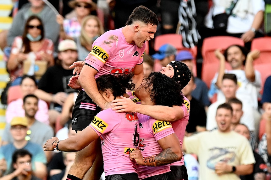 Nathan Cleary jumps in the air above three of his teammates
