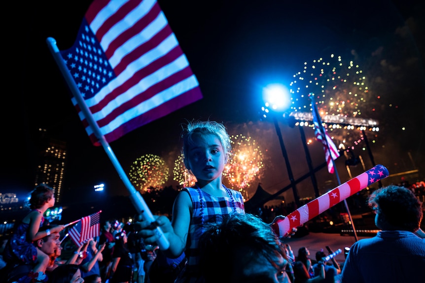 Young girl watches fireworks in the US