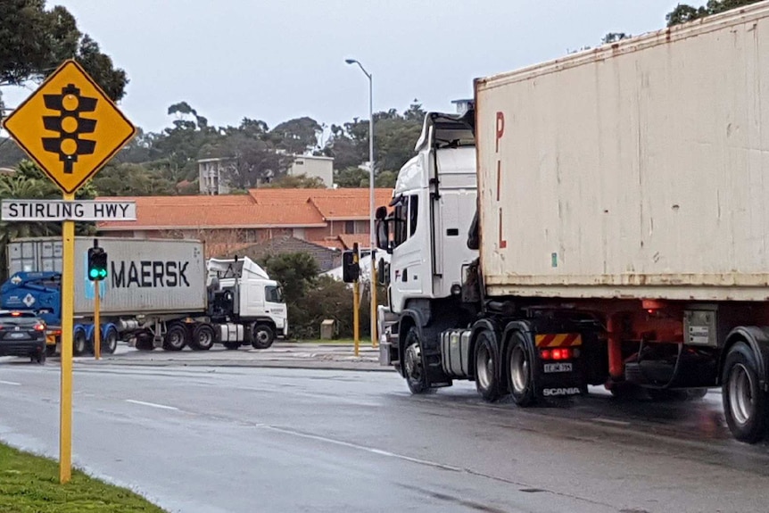 Trucks waiting to turn onto Stirling Highway at the High Street intersection in Fremantle.